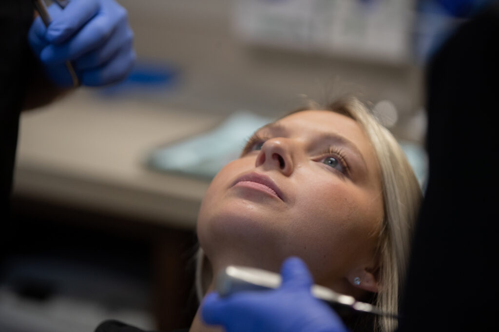 woman with her head laying back waiting for an oral procedure